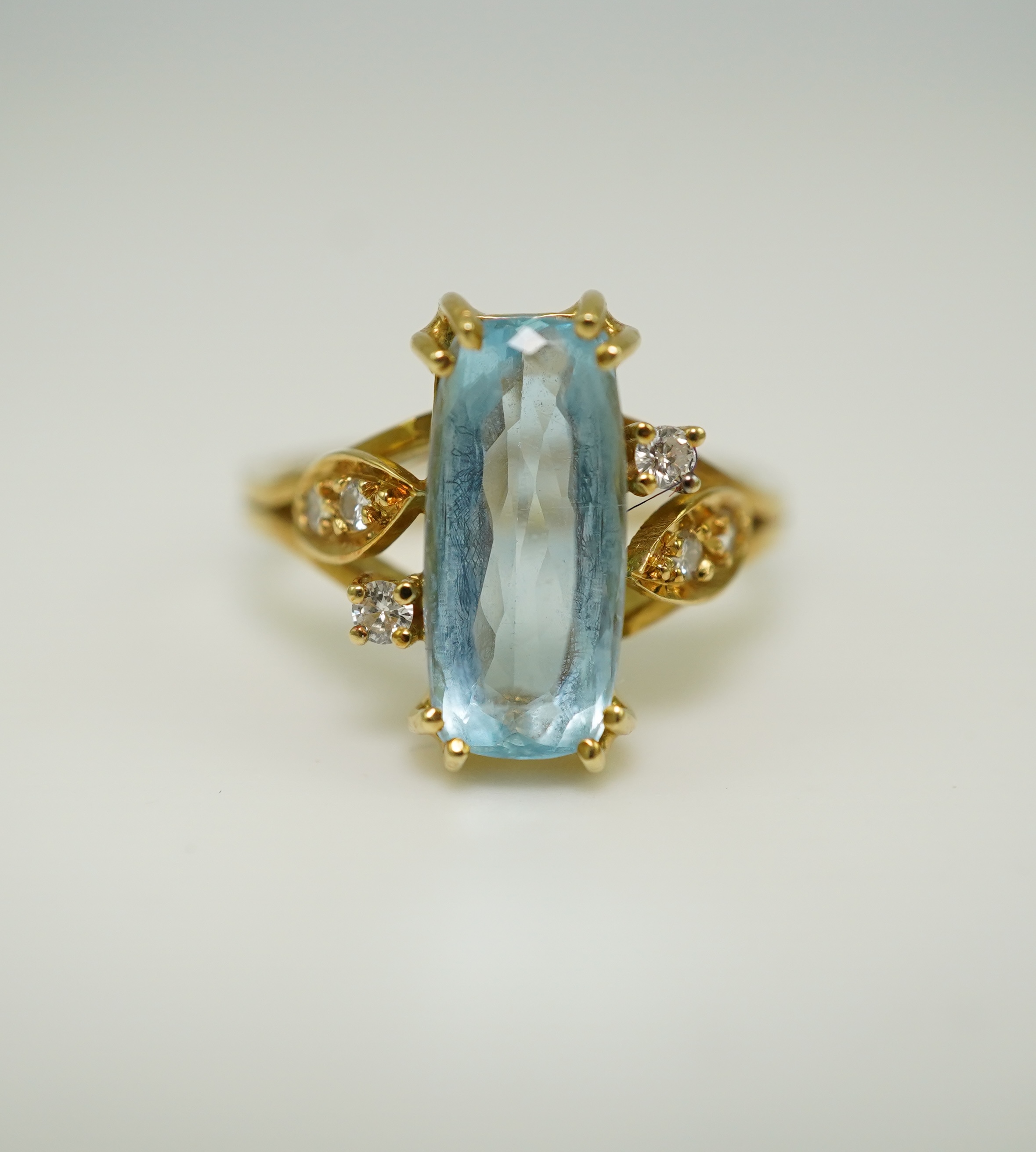 An aquamarine and diamond ring